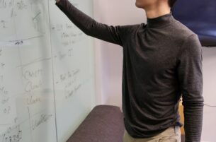 grant ho writing on white board